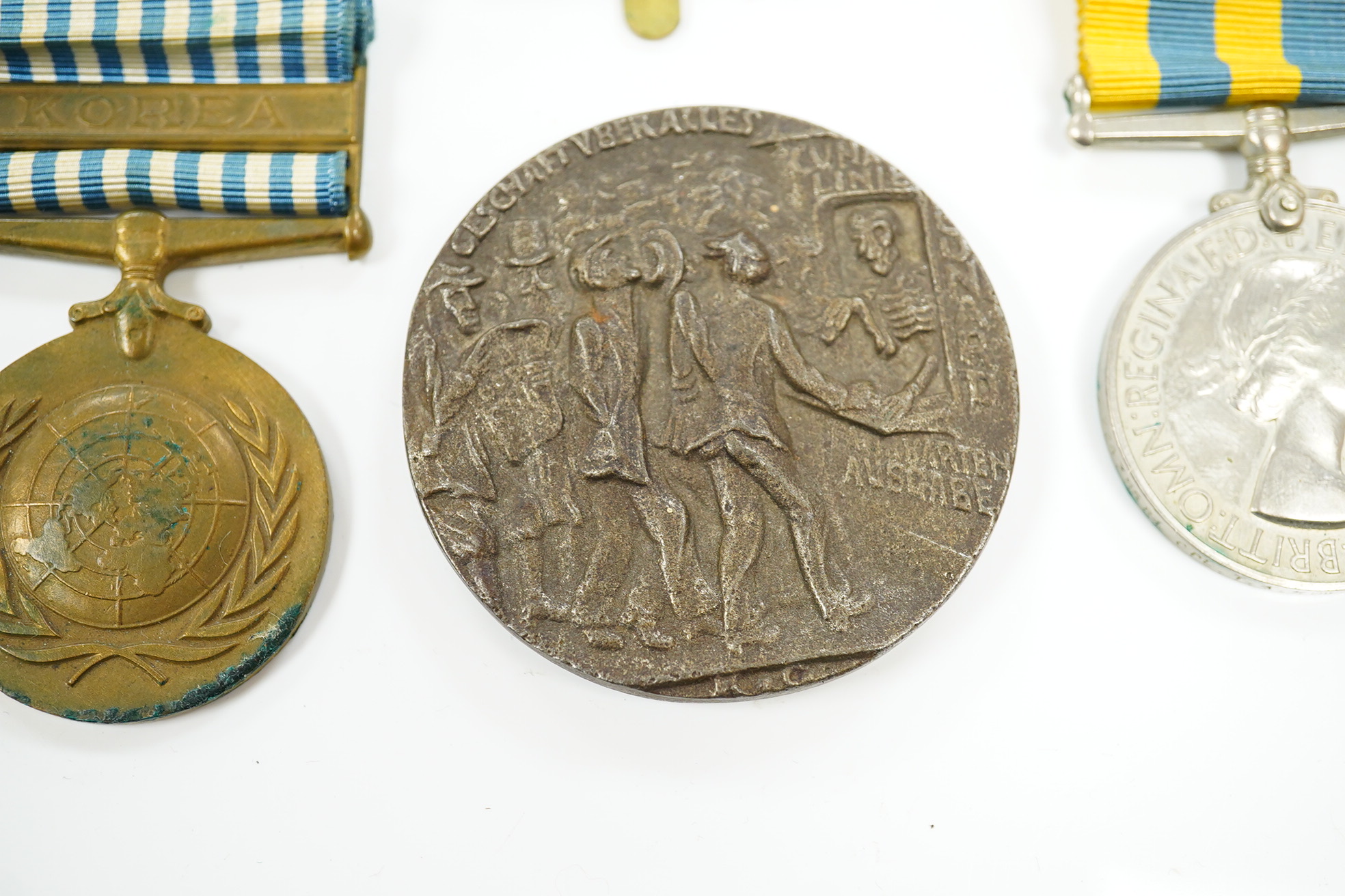 A First World War medal pair awarded to SJT. F.C. Howkins, The Queen’s R., together with a QEII Korea medal pair awarded to CPL. T.A. Howkins, R. Norfolk, plus a Lusitania propaganda medallion, all contained in a Princes